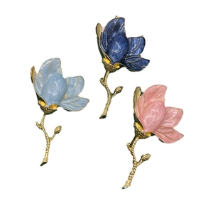 Three-piece set of enamel magnolia brooches in light blue, dark blue and pink floral designs
