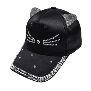 Close-up of black baseball cap featuring 3D cat ears and sparkling rhinestone whiskers