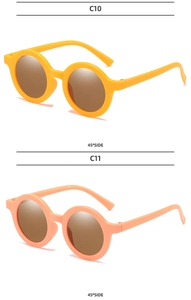 Detail view of yellow C10 and orange C11 round kids sunglasses from a 45-degree angle