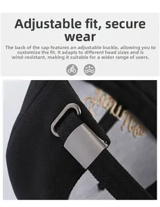 Macro detail of silver adjustable metal buckle and gold embroidery on black baseball cap