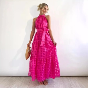 Elegant rose pink halter neck maxi dress with textured checkered fabric and waist tie