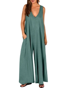 Detail view of the deep V-neck and soft knit texture of this green sleeveless jumpsuit