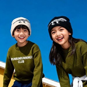 Kids winter knit beanie with dinosaur skeleton pattern and matching green sweater set