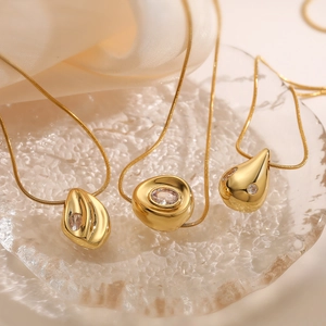 Minimalist gold plated necklace set with irregular geometric pendants and zircon stones