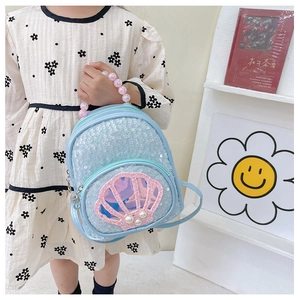 Detail of blue sequin backpack with shell window and pink beaded handle for girls
