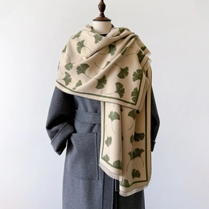 Elegant beige pashmina scarf with green ginkgo leaf patterns and fringe tassels