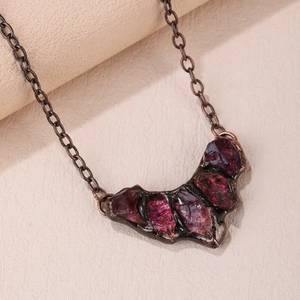 Vintage bohemian necklace with purple raw crystals and bronze finish moon pendant