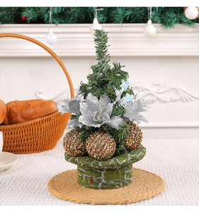 Mini Christmas tree ornament with pine needles and red glitter balls on a green hat base