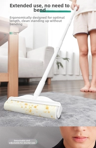 Long handle lint roller removing debris from carpets without bending over easily