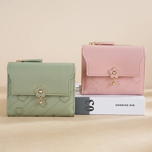 Women's short PU leather wallets in pink and green with floral embroidery and gold charms