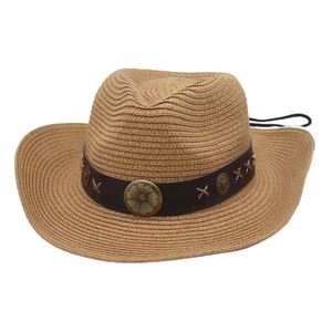 Western straw cowboy hat in light brown with decorative leather band and metal floral accents