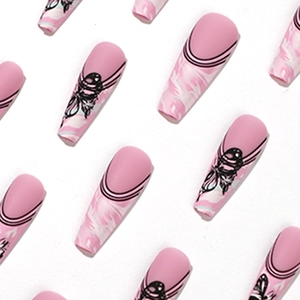 Long ballet press-on nails in nude pink with black lines and butterfly marble design