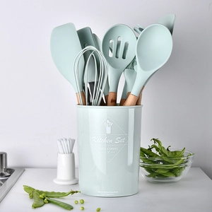 11-piece mint green silicone kitchenware set with heat-resistant wooden handles and holder