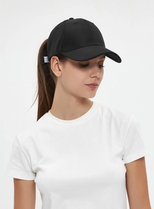 Classic black ponytail baseball cap in premium cotton shown on a female model
