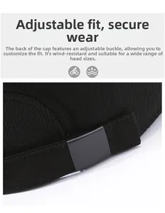 Detail of the adjustable metal slider buckle on the back of a black cotton baseball cap
