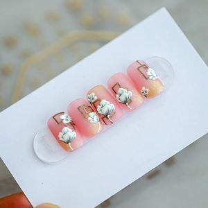 Pink gradient nail stickers with 3D embossed flowers and golden glitter accents