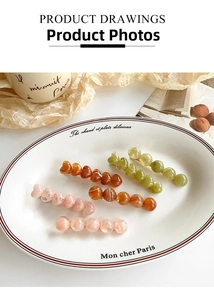 French vintage style heart resin hair clips in pastel colors on a ceramic plate
