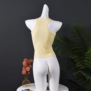 Detail view of the back of a light yellow ribbed knit slim fit tank top for women