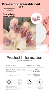 Close-up of pink gradient press-on nails with 3D purple butterflies and glitter details