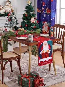 Detail of Christmas table runner with Santa Claus prints and Happy Holidays text