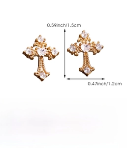 Detail view of gold cross earrings with heart zircon, size 1.5cm x 1.2cm, 2g weight