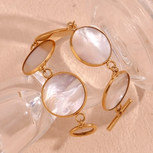 Detailed view of 18K gold plated OT buckle bracelet with circular white mother of pearl