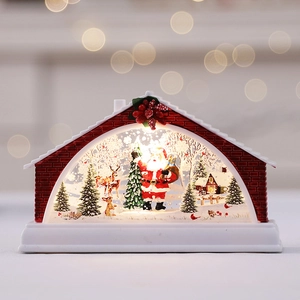 Lighted Christmas snow globe lantern in house shape with Santa Claus and reindeer scene