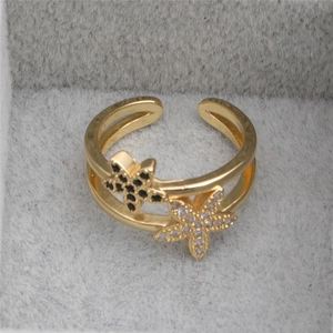 Golden double-layer open ring featuring black and white starfish encrusted with zircons