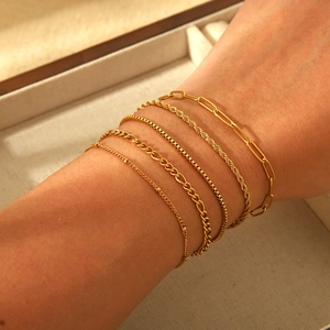 Set of six 18K gold plated stainless steel layered bracelets with various chain textures