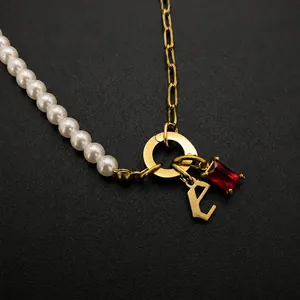 Stainless steel initial E necklace with white imitation pearls and red crystal pendant charms