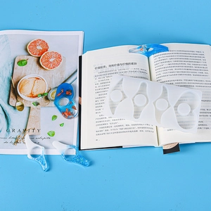 Macro detail of translucent silicone resin mold for creating ergonomic DIY book page holders