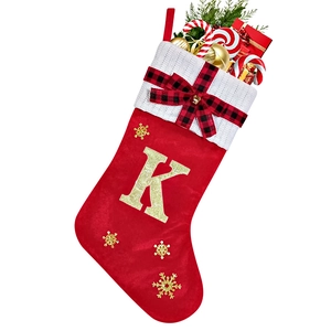 Close-up of red Christmas stocking with golden glitter letter K and knit cuff