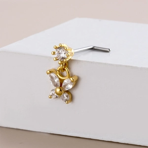 Golden butterfly zircon nose stud with L-shaped stainless steel rod on white cube