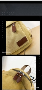Detail view of smooth zippers with leather pullers and embossed logo on yellow canvas bag