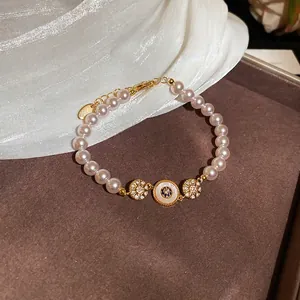 Bracelet élégant plaqué or 18k avec perles d'eau douce et breloques tournesol en zircon