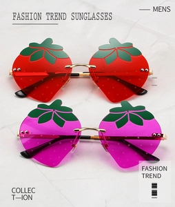 Close-up of rimless strawberry-shaped sunglasses with pink and red tinted lenses
