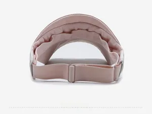 Rear view of pink visor hat showing adjustable elastic strap and buckle detail