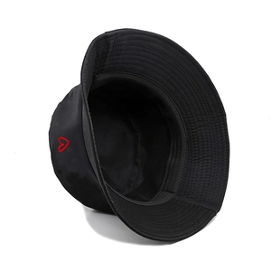 Detailed view of the red heart embroidery on the side of a black cotton bucket hat