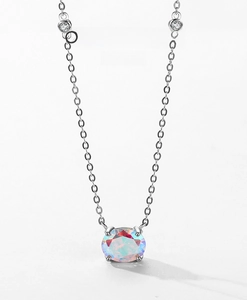 Detailed macro view of S925 silver necklace with oval opal and round cubic zirconia