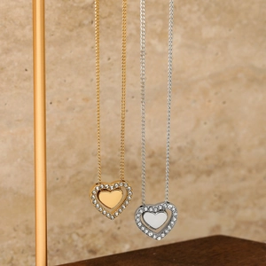 Fashion heart pendant necklace in gold and silver finish with sparkling zircons