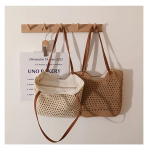 Detail of hollow woven cotton shoulder bag with leather strap and secure zipper lining