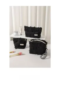 Detailed view of black frayed edge cotton linen cosmetic bags set with metal zippers