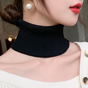 Close-up of a women's black ribbed knit turtleneck dickey collar for neck warmth