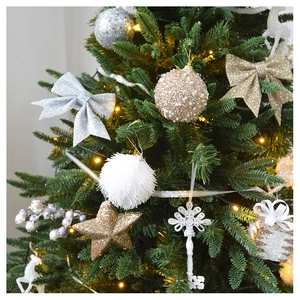 Detail of glittery gold and silver Christmas tree ornaments with sequins and velvet textures