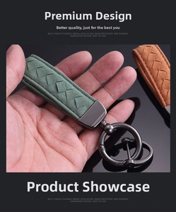 Detailed view of woven suede car keychain with gunmetal buckle and flexible ring