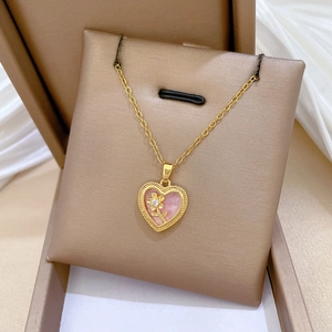 Luxury titanium steel heart necklace with pink shell inlay and sparkling gold flower