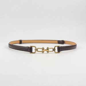 Detail of adjustable dark brown leather belt with interlocking antique bronze U-buckle