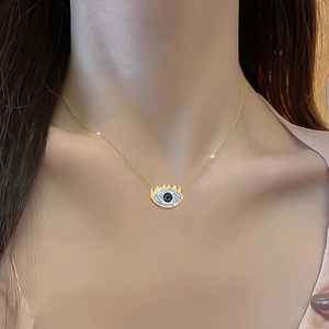 Titanium steel evil eye pendant necklace with crystals shown on a model's neck