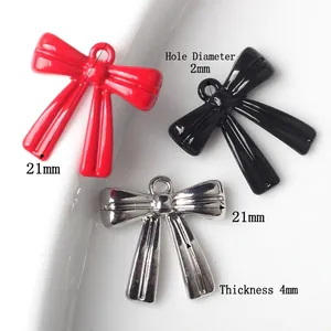 Minimalist alloy bow pendants in red and black lacquer for DIY jewelry making