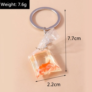 Detailed view of goldfish charm keychain with dimensions 7.7cm height and 2.2cm width